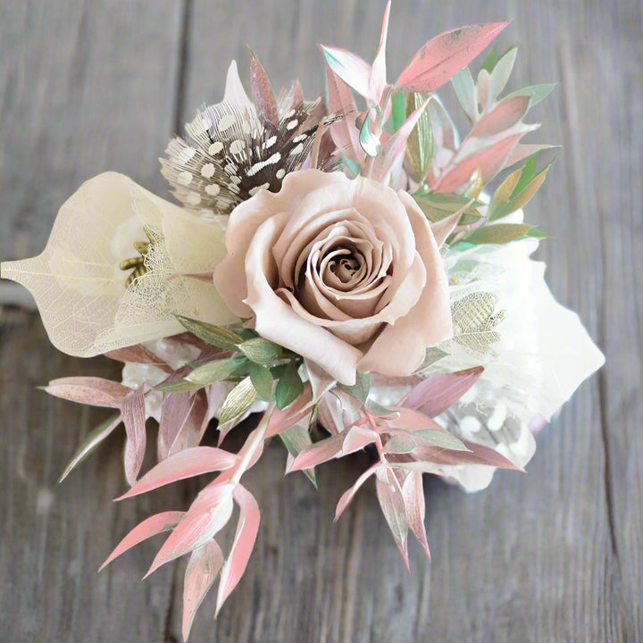 Wrist Corsage - Magnolia the Florist Make the day truly memorable with one of our signature floral wrist corsages featuring a mix of seasonal textures and blooms. All arranged onto a beautiful Peal bracelet.