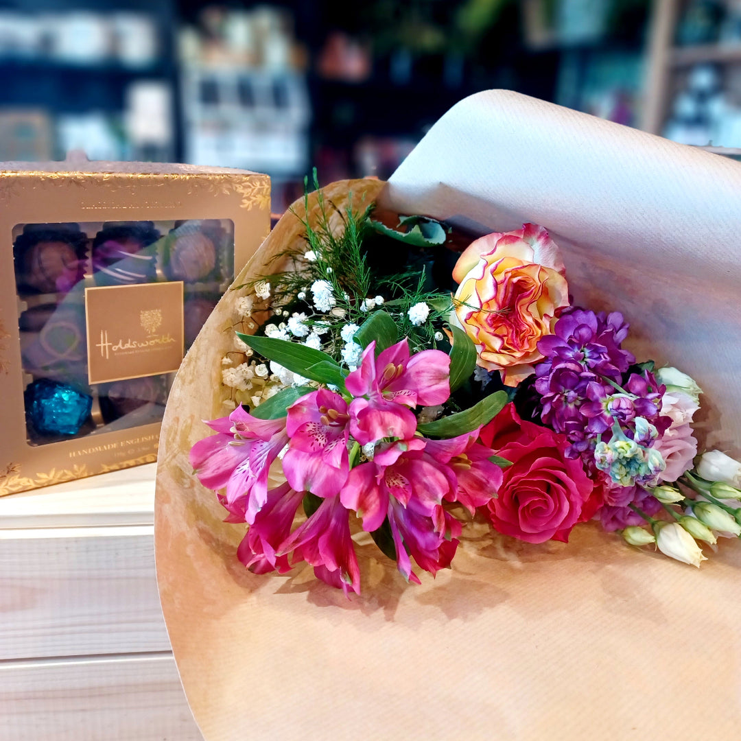 A selecion of summer type blooms with a box of Holdworth 110g Chocolates