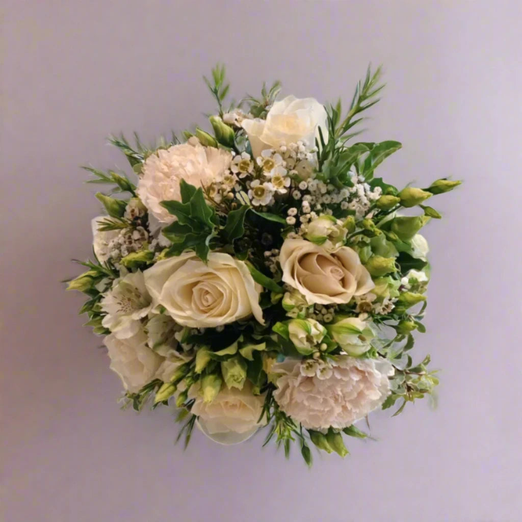 Wild N Free Bridesmaid Bouquet - Magnolia the Florist An abundant bridal bouquet featuring the best blooms the season has to offer.Select your colour palette and we’ll craft a stunning design just for you!