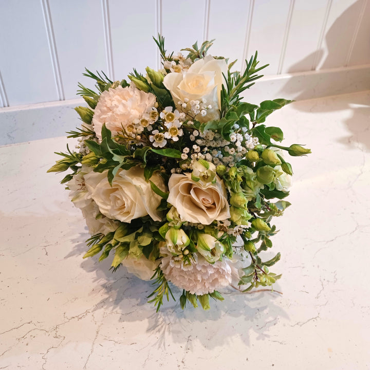 Wild N Free Bridesmaid Bouquet - Magnolia the Florist An abundant bridal bouquet featuring the best blooms the season has to offer.Select your colour palette and we’ll craft a stunning design just for you!